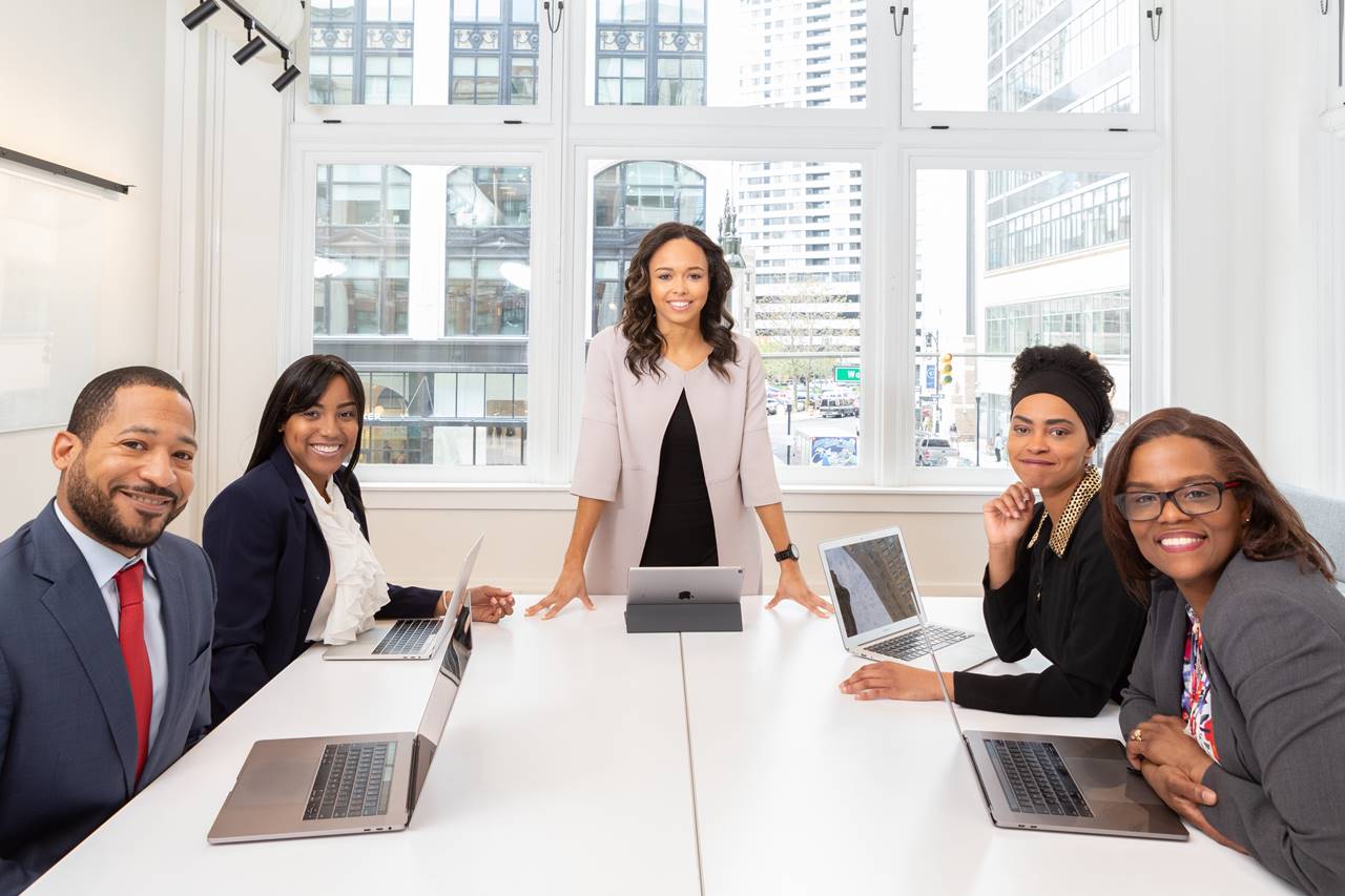 Group of people in a meeting with Laptops. Outlook Meeting Requests