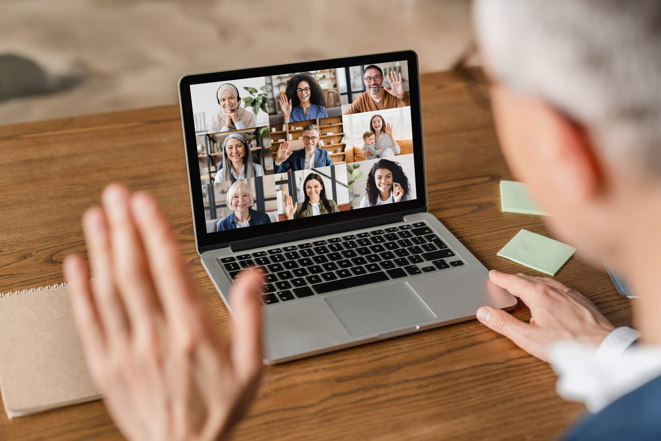 Person viewing online meeting on Laptop. Remove add online meetings default.